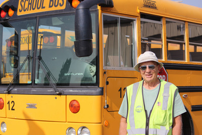 Bus Driver in front of Bus