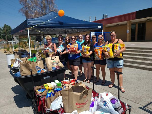 shasta staff pose with food donations